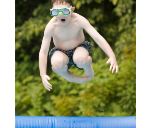 child jumping into a swimming pool cannonball style